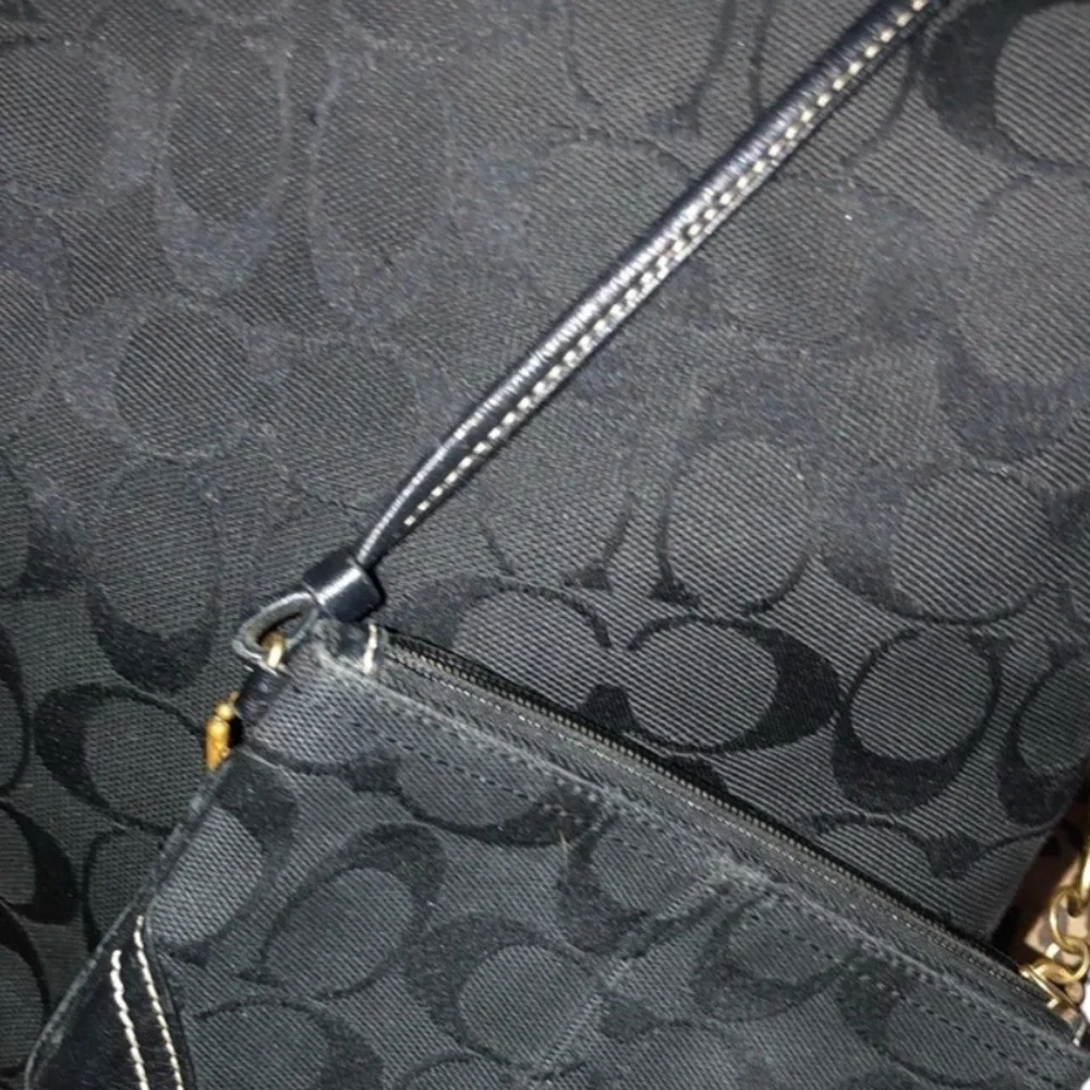 Coach black canvas monogram shoulder bag , leather trim see matching pieces